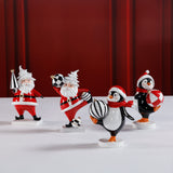 Festive Four Santa & Penguin Figurines, Set of 4, Holiday Decoration, 7" Tall